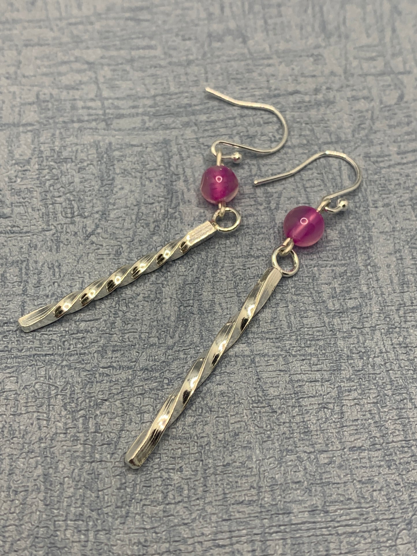 Handmade sterling silver long twisted earrings with pink quartz