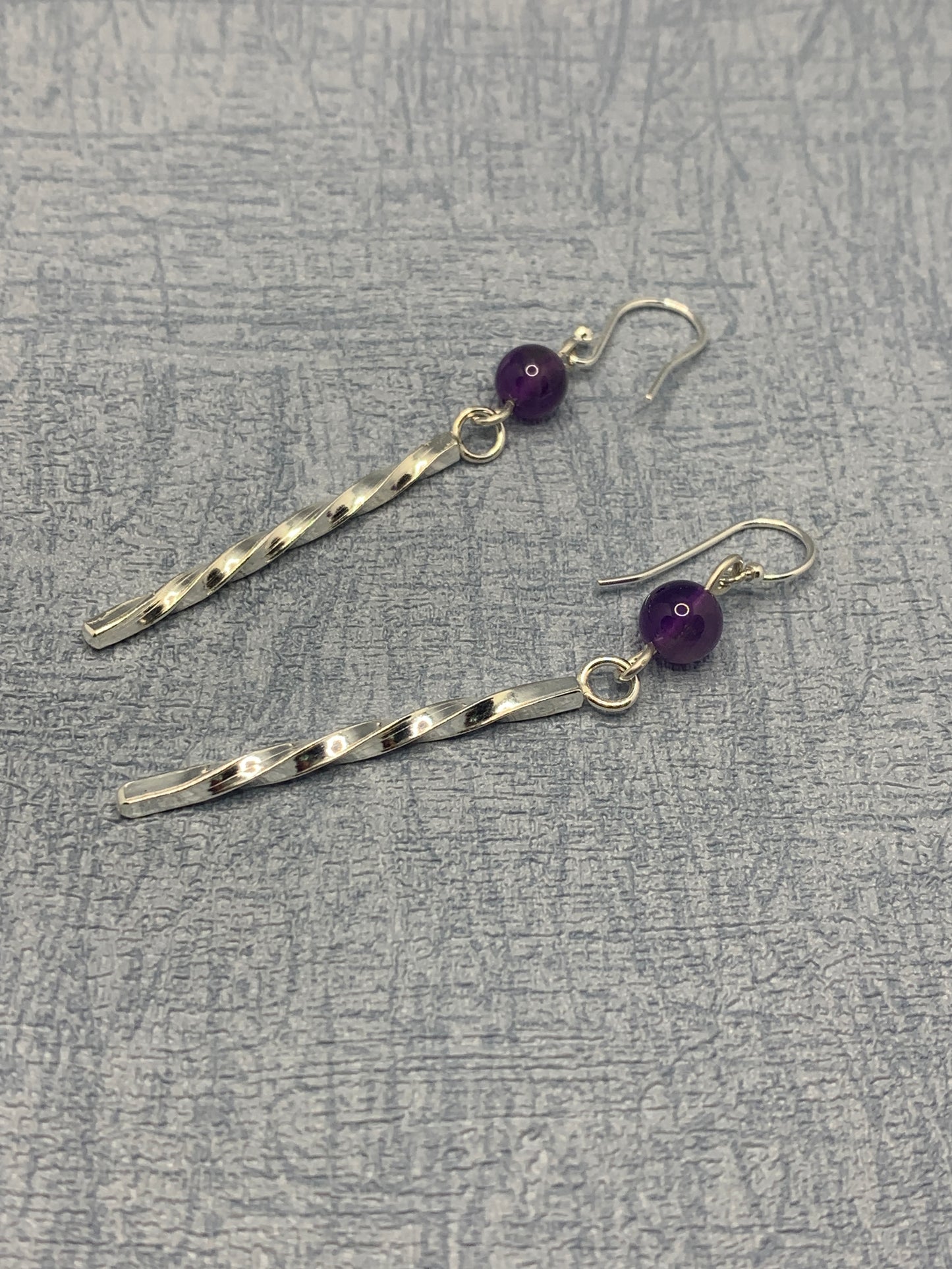 Handmade sterling silver long twisted earrings with amethyst