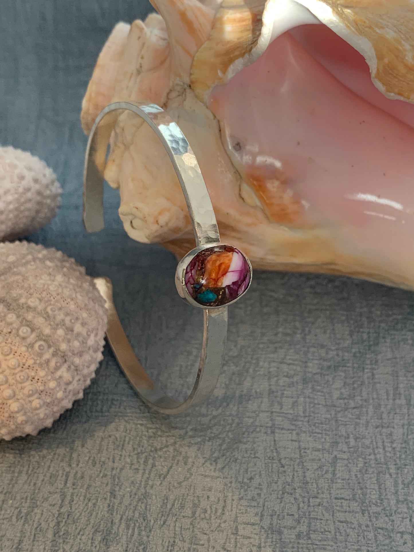 handmade hammered sterling silver cuff with spiny oyster turquoise gemstone