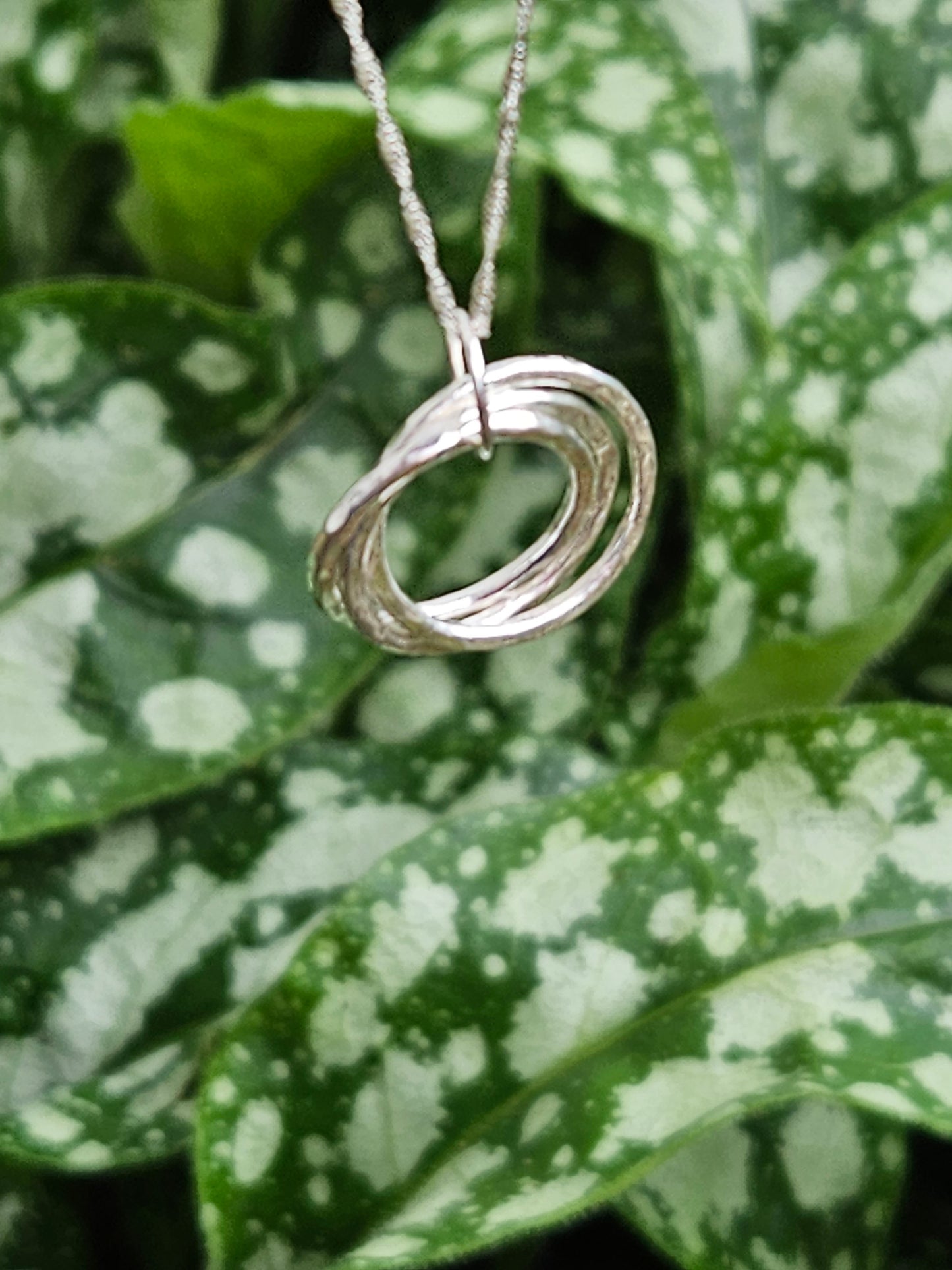 Handmade sterling silver three ring pendant