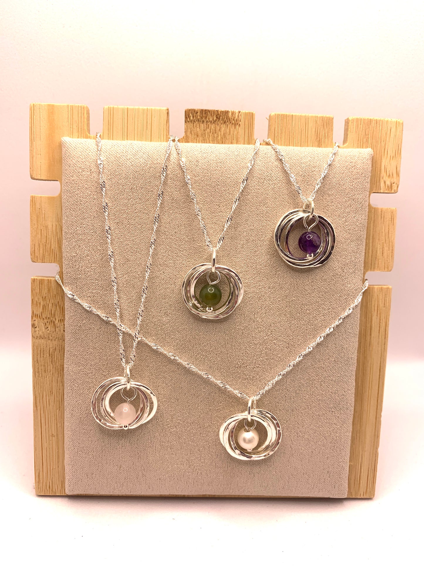 Handmade sterling silver three ring pendant with pearl, amethyst, moss agate and rose quartz