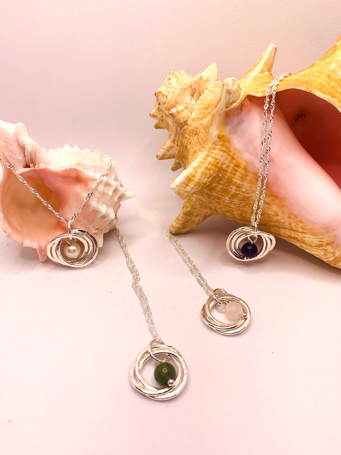 Handmade sterling silver three ring pendant with pearl, amethyst, moss agate and rose quartz