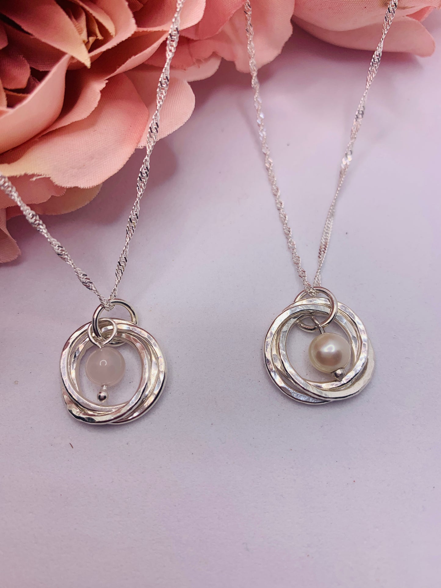 Handmade sterling silver three ring pendant with pearl and rose quartz
