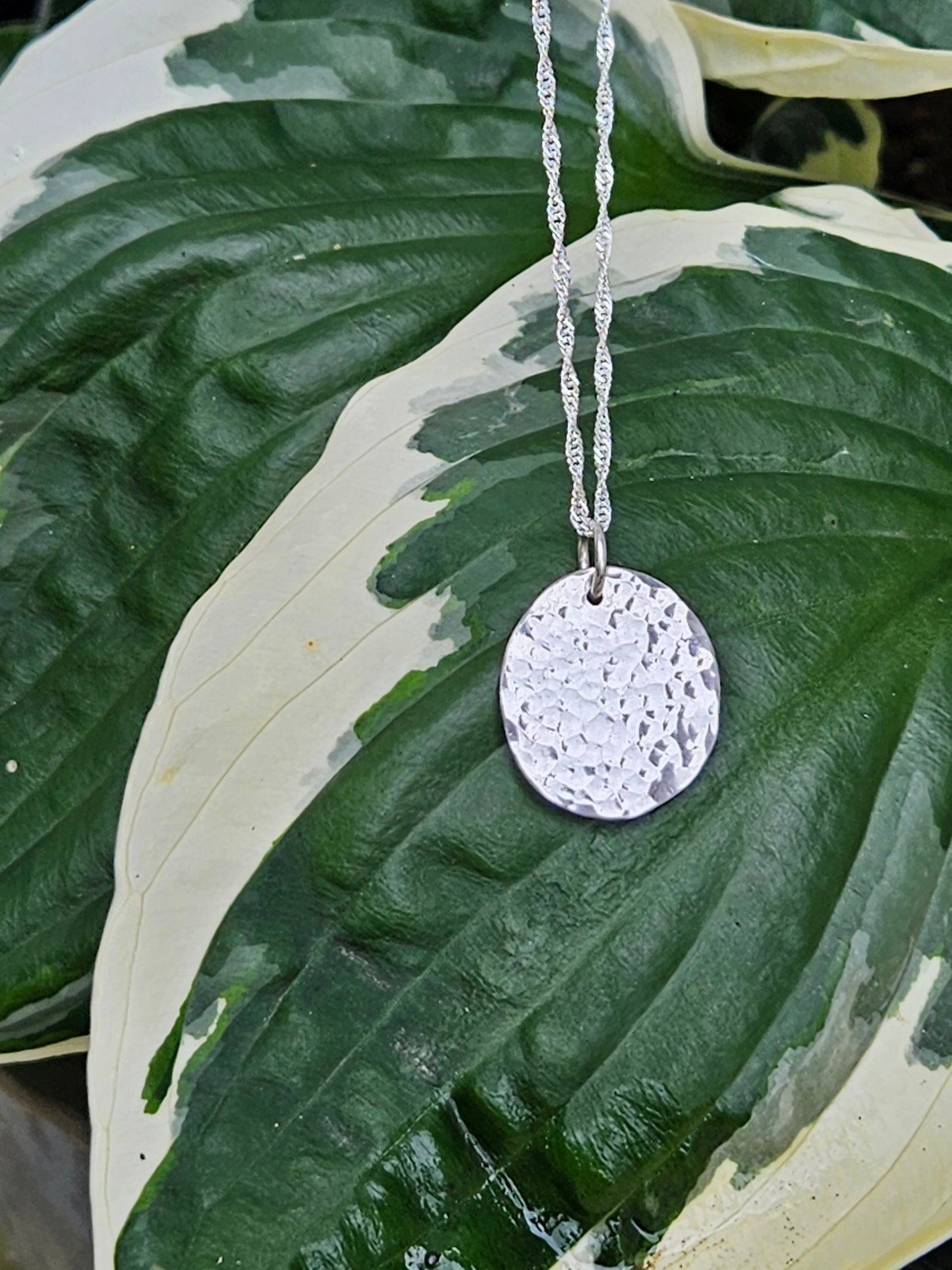 Handmade sterling silver hammered disc pendant