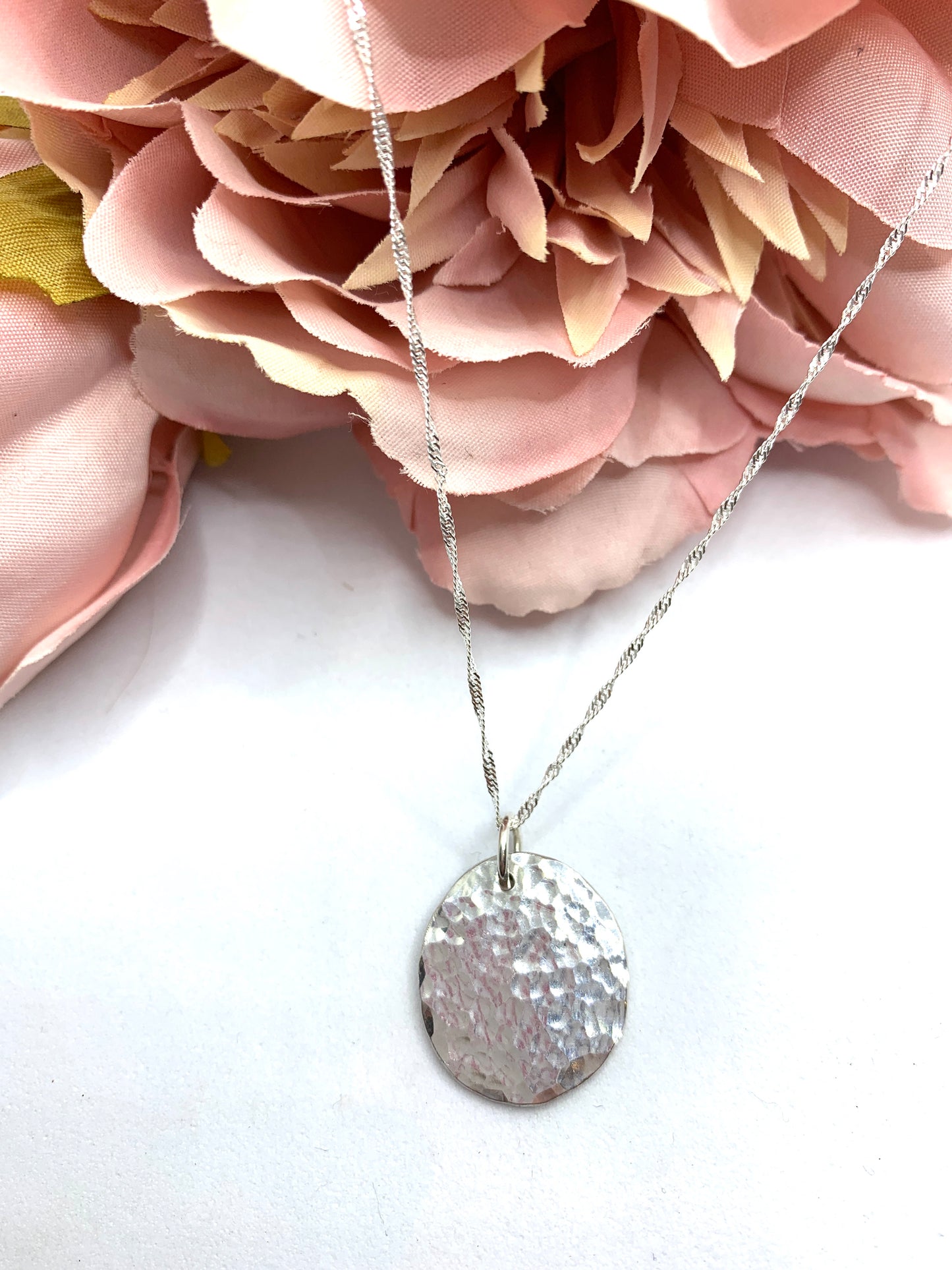 Handmade sterling silver hammered disc pendant