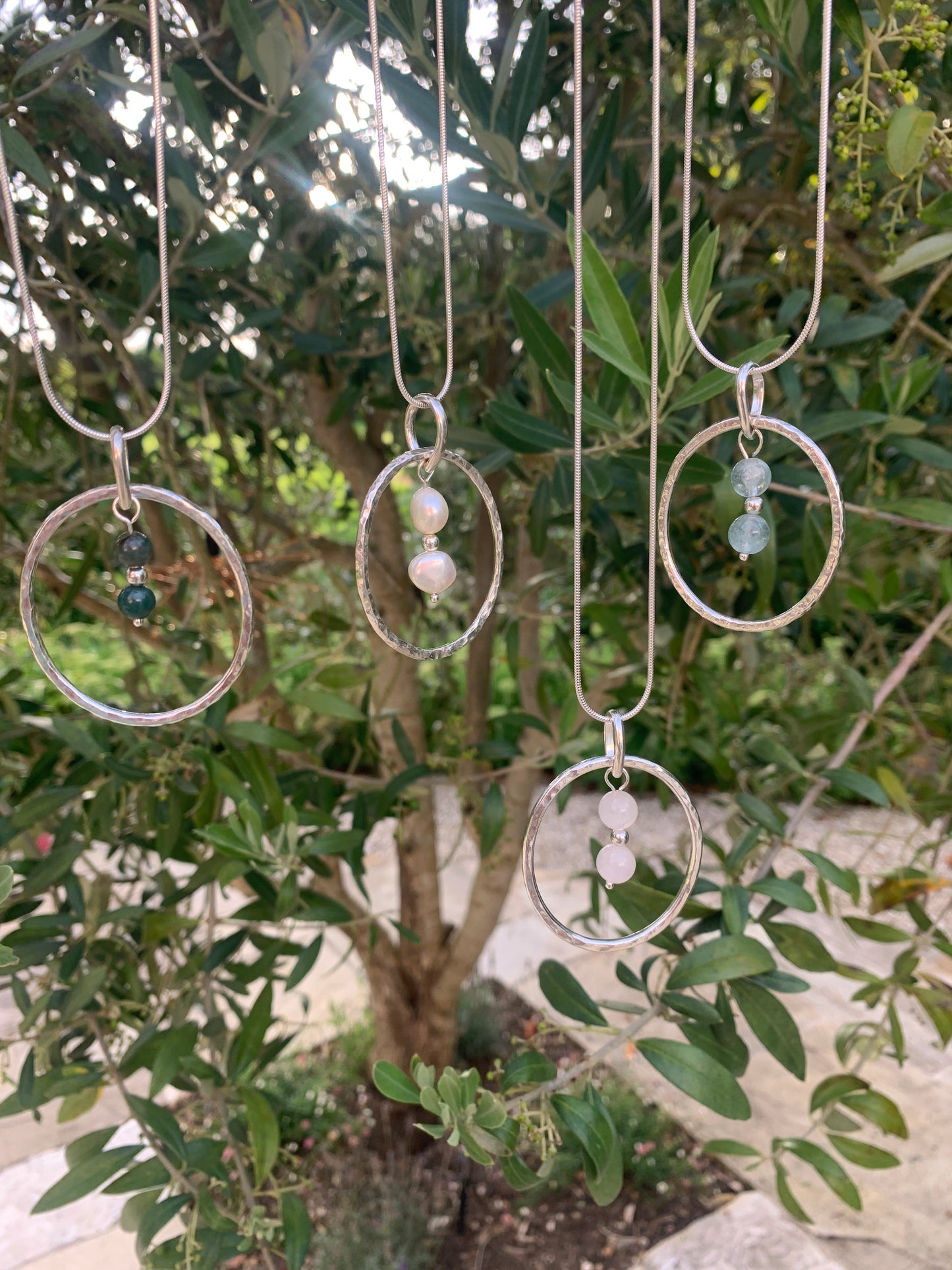Handmade sterling silver hammered ring pendant with aquamarine, moss agate, pearls and rose quartz
