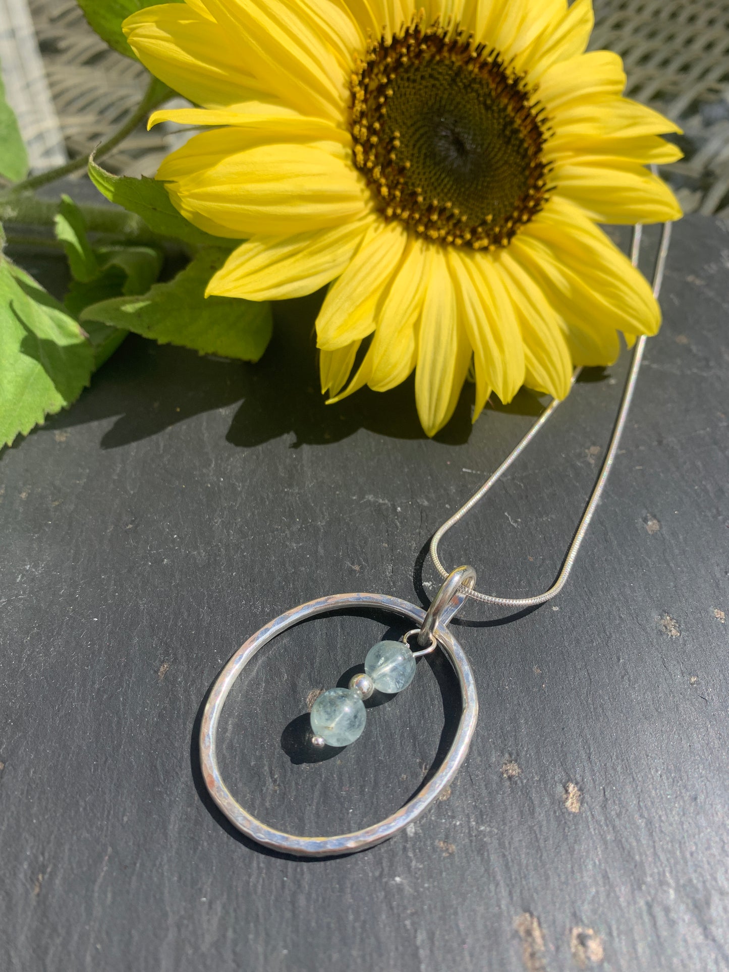 Handmade sterling silver hammered ring pendant with aquamarine