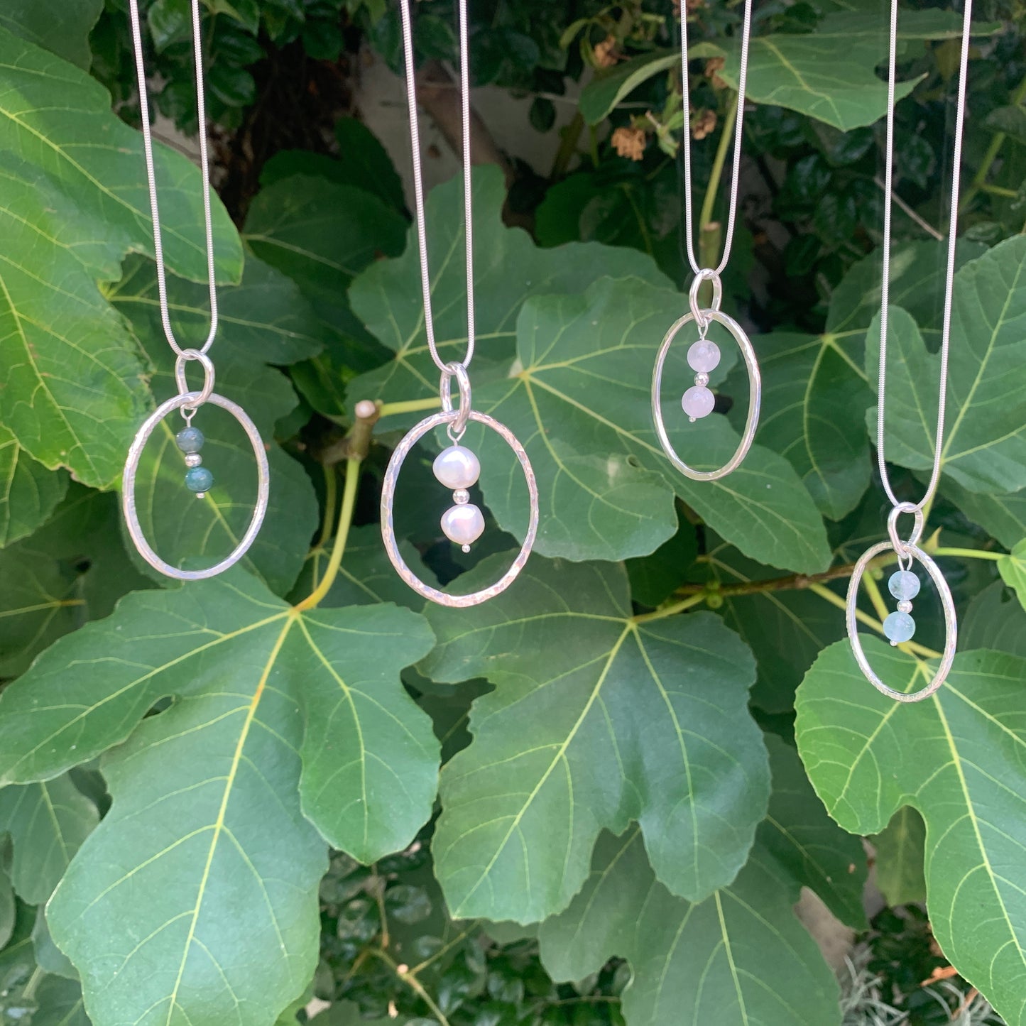 Handmade sterling silver hammered ring pendants with rose quartz, pearls, rose quartz and aquamarine