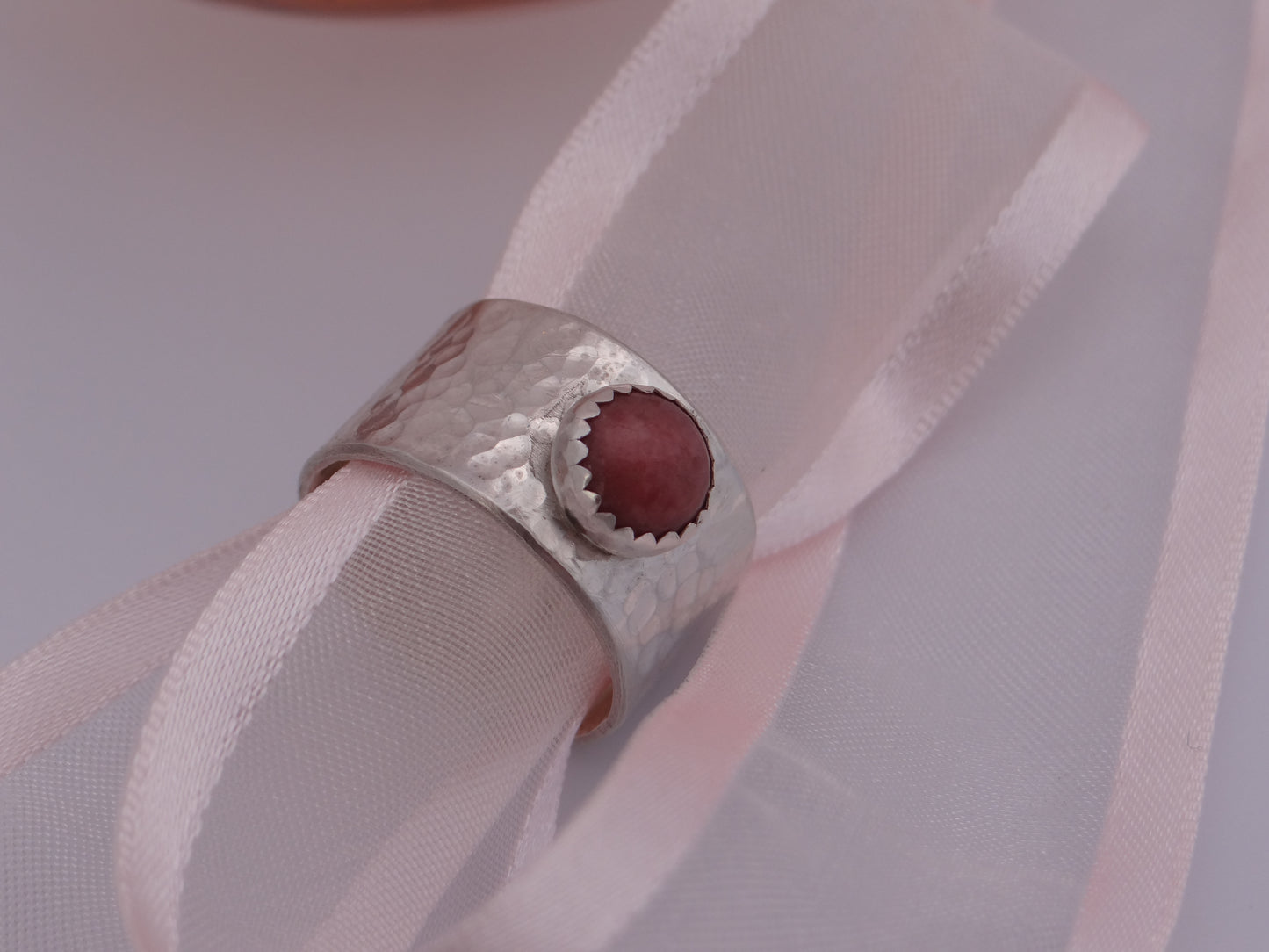 Handmade sterling silver hammered wide ring with rhodochrosite gemstone