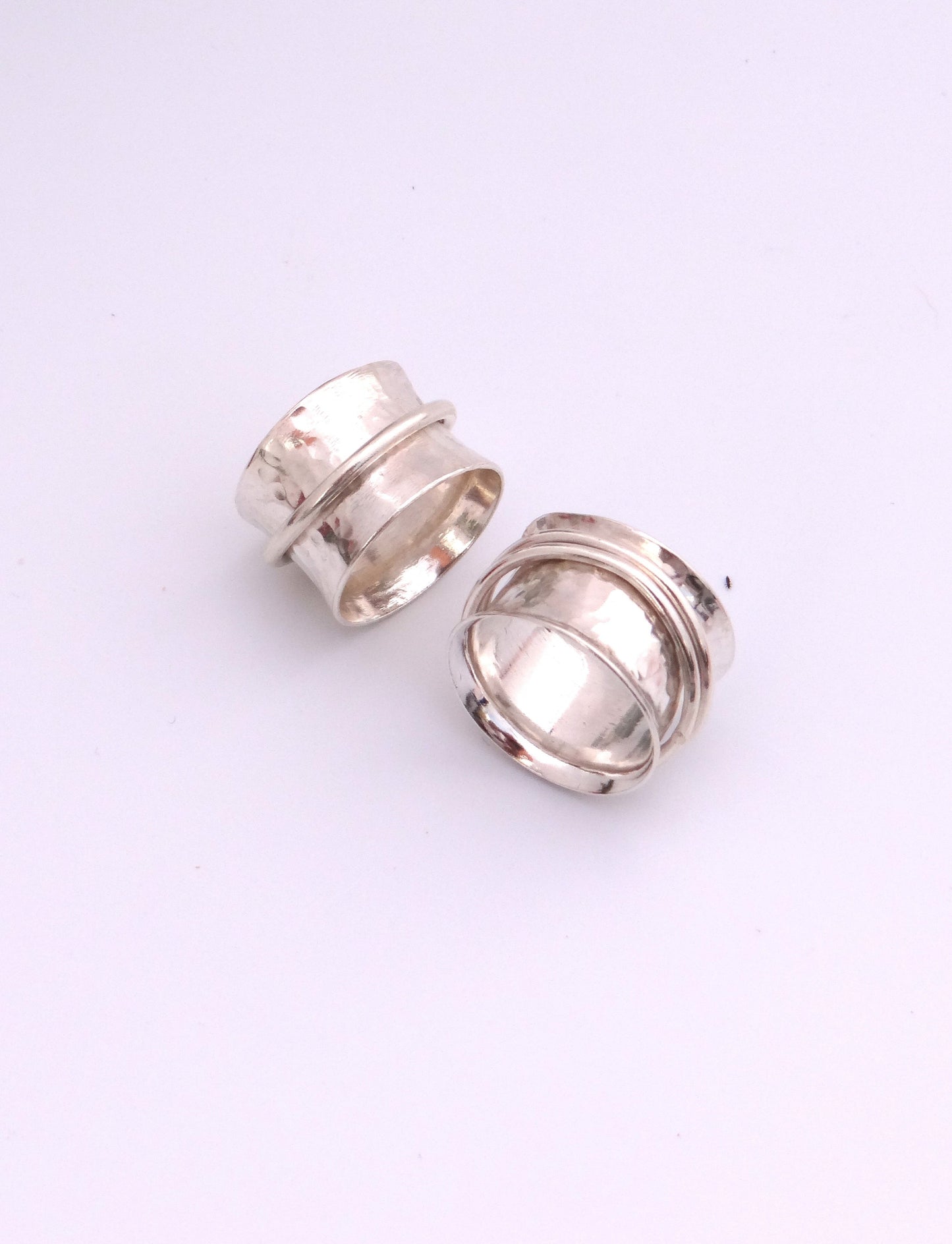 Handmade sterling silver hammered spinner rings
