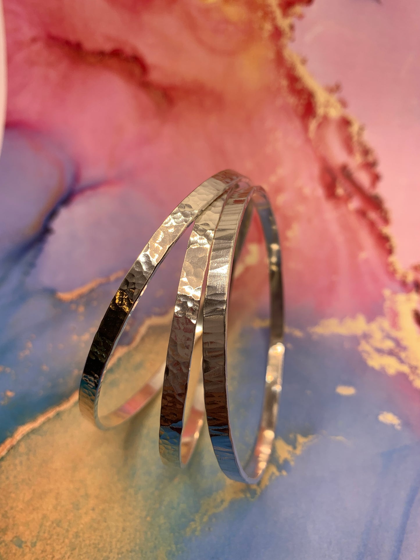 Handmade sterling silver hammered bangles