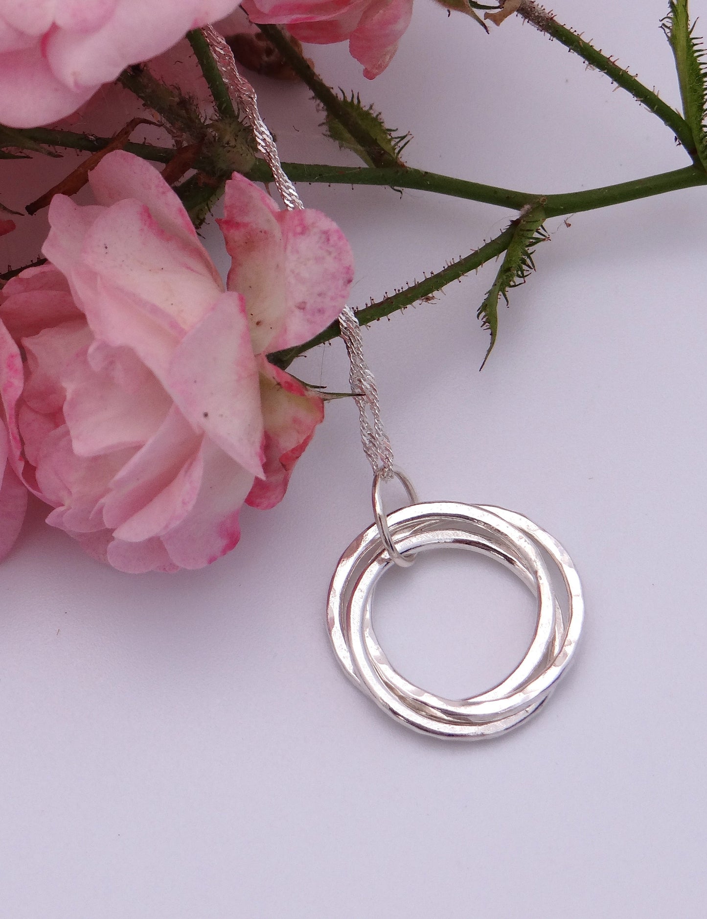 Handmade sterling silver three ring pendant