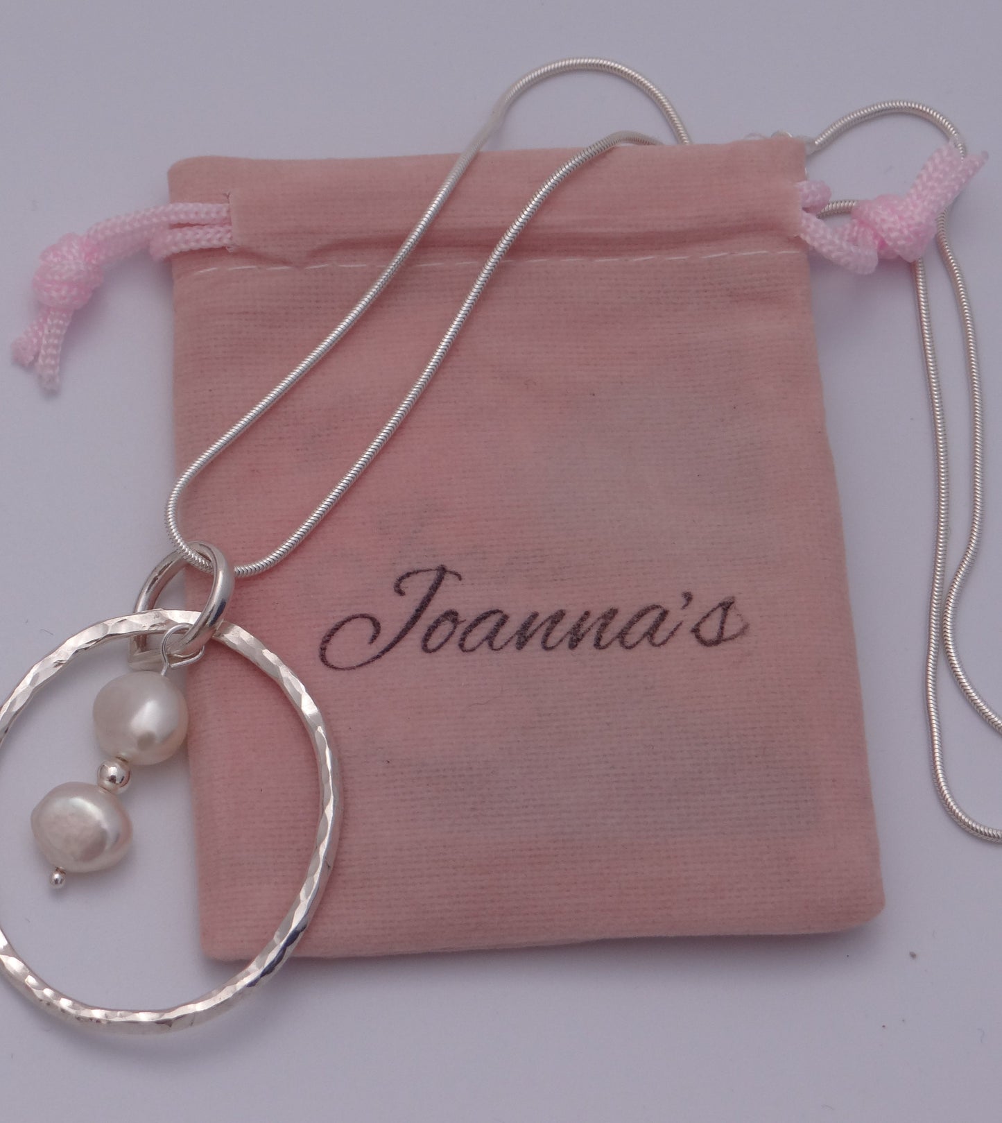 Joanna's Designs packaging with large circle sterling silver pendant with pearls
