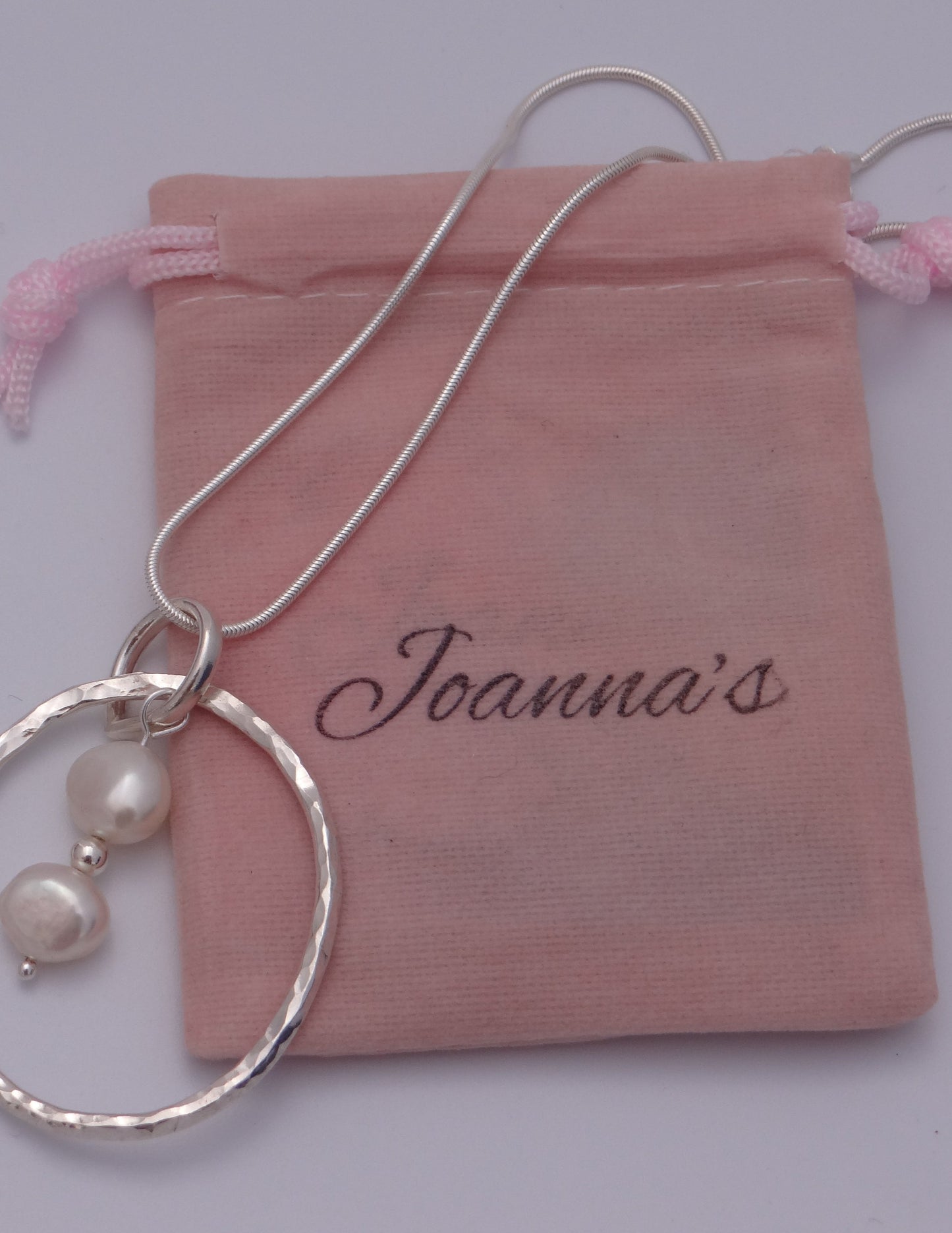 Joanna's Designs packaging with large circle sterling silver pendant with pearls
