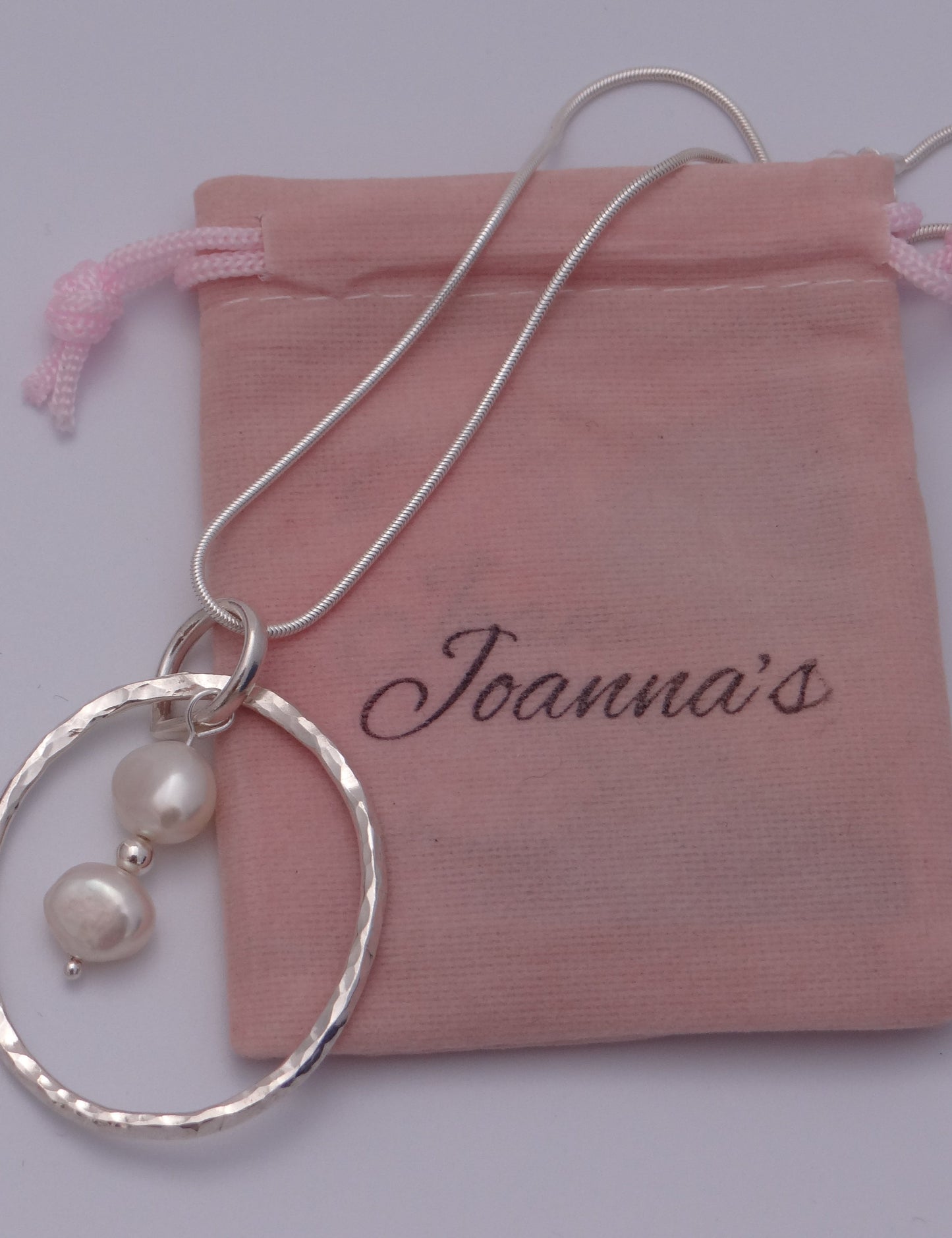 Joanna's Designs packaging with large circle sterling silver pendant with pearls