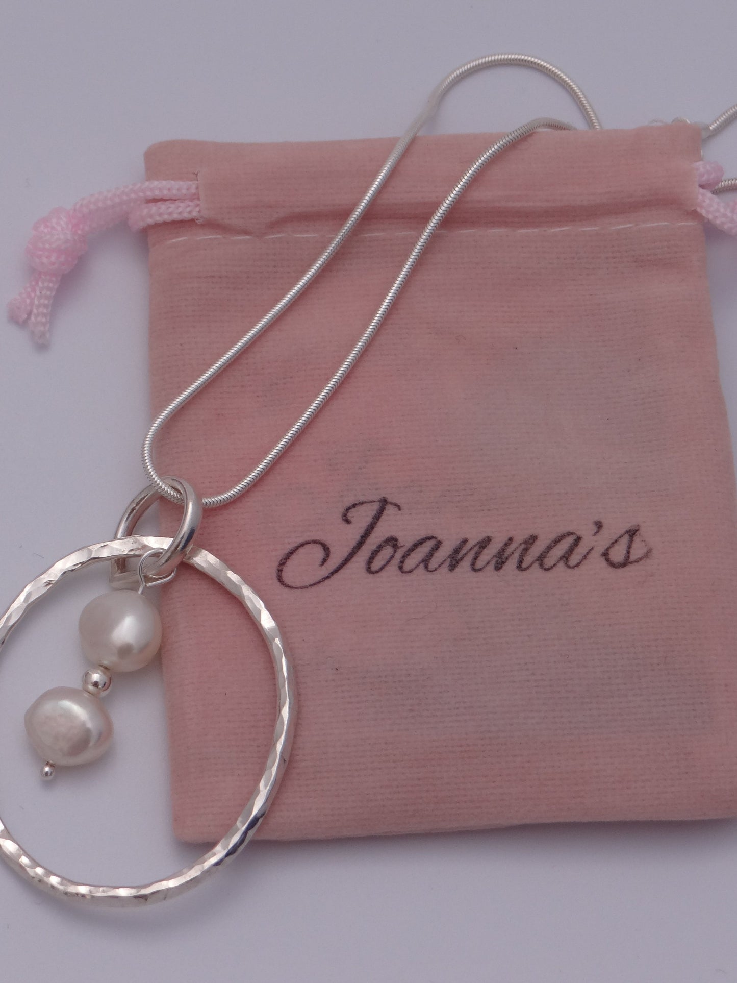 Joanna's Designs packaging with large circle sterling silver pendant with pearls