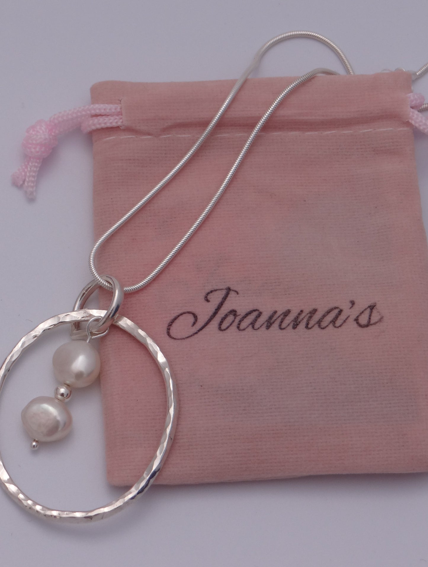 Joanna's Designs packaging with large circle sterling silver pendant with pearls