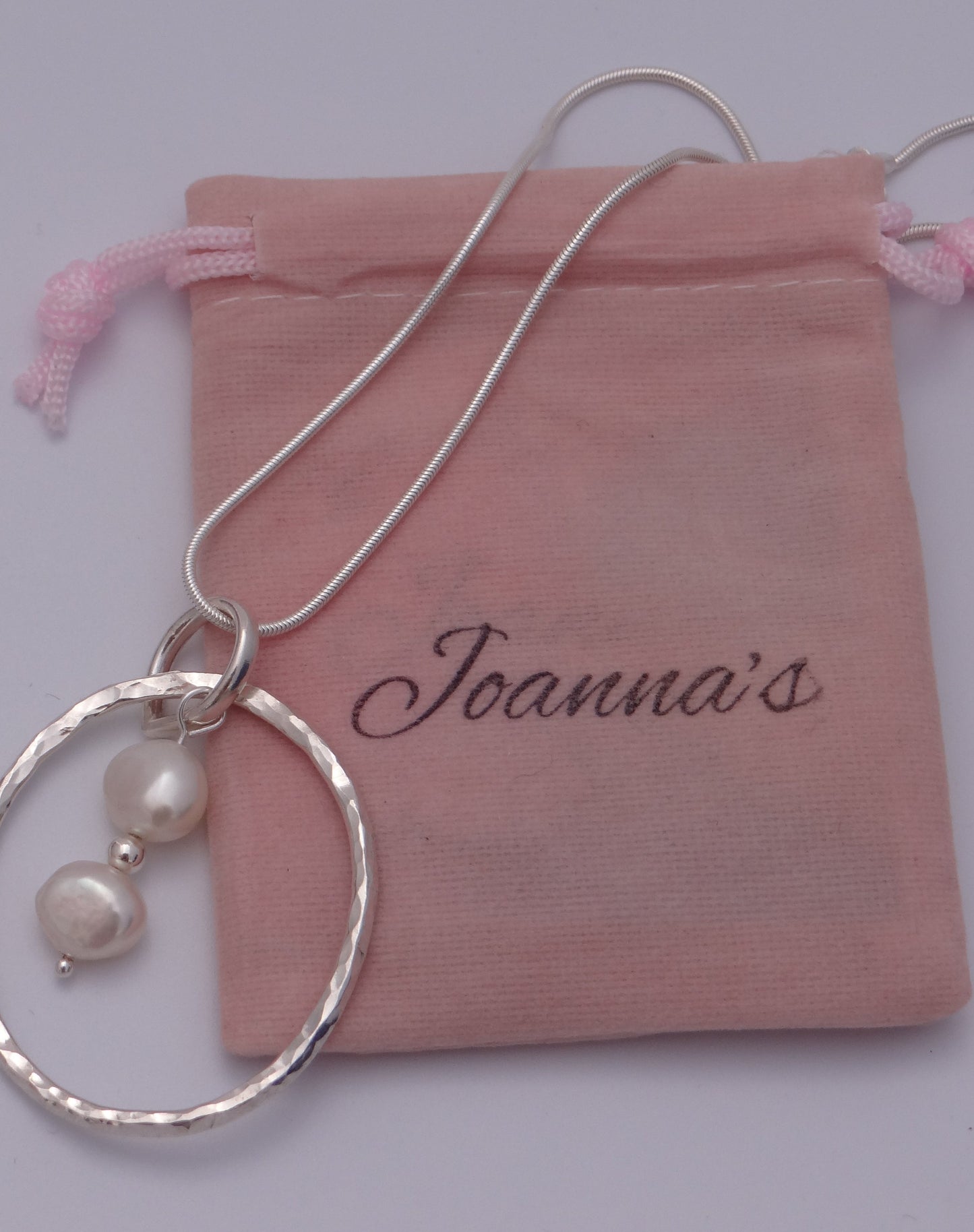 Joanna's Designs packaging with large circle sterling silver pendant with pearls
