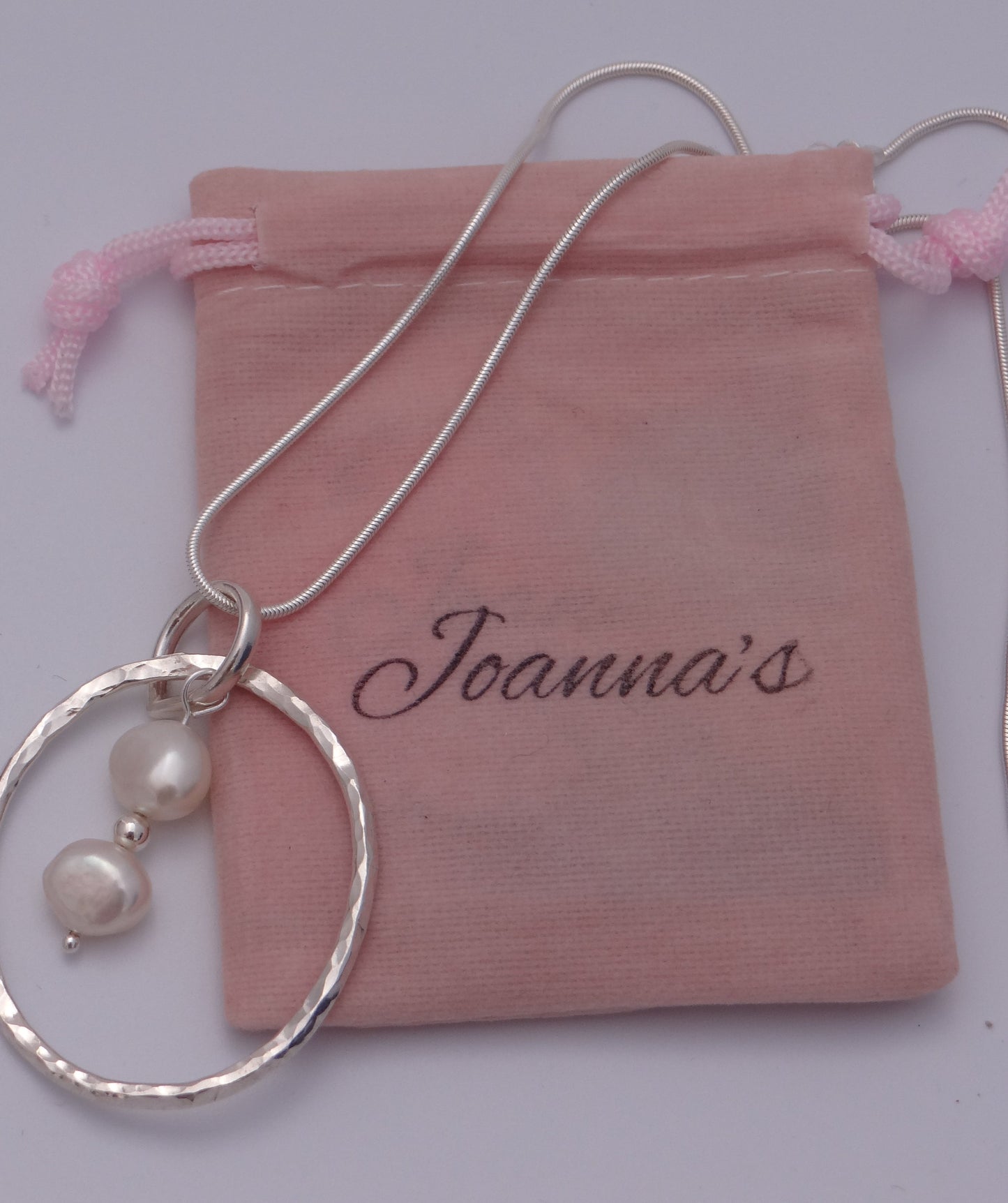 Joanna's Designs packaging with large circle sterling silver pendant with pearls