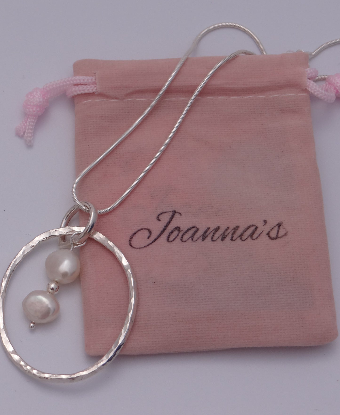 Joanna's Designs packaging with large circle sterling silver pendant with pearls