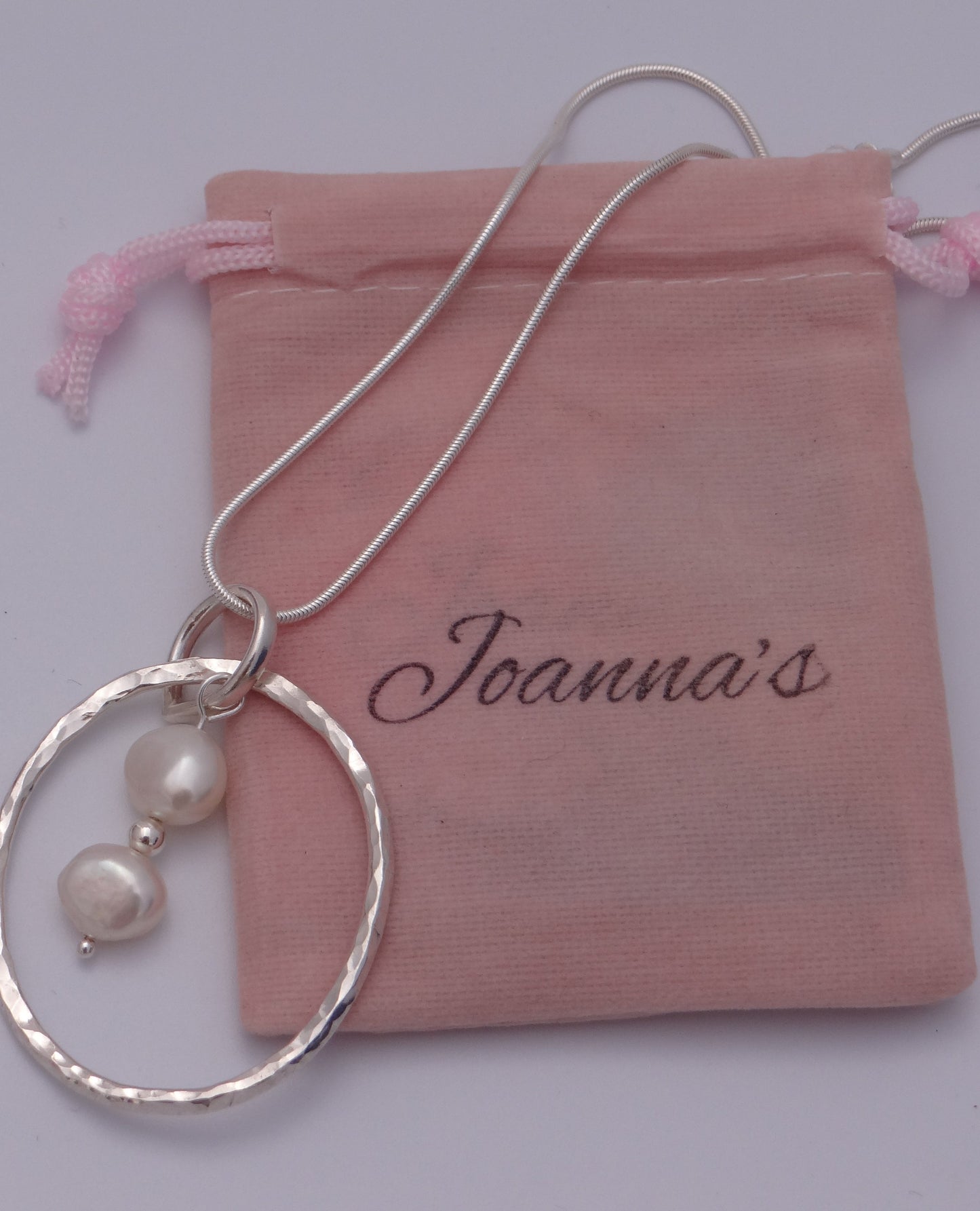 Joanna's Designs packaging with large circle sterling silver pendant with pearls