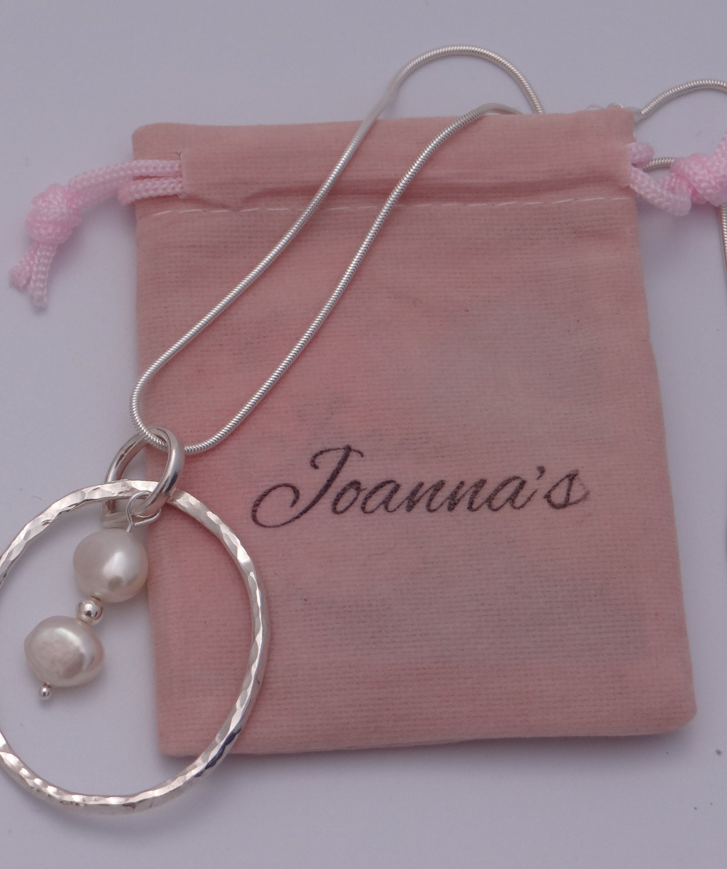 Joanna's Designs packaging with large circle sterling silver pendant with pearls