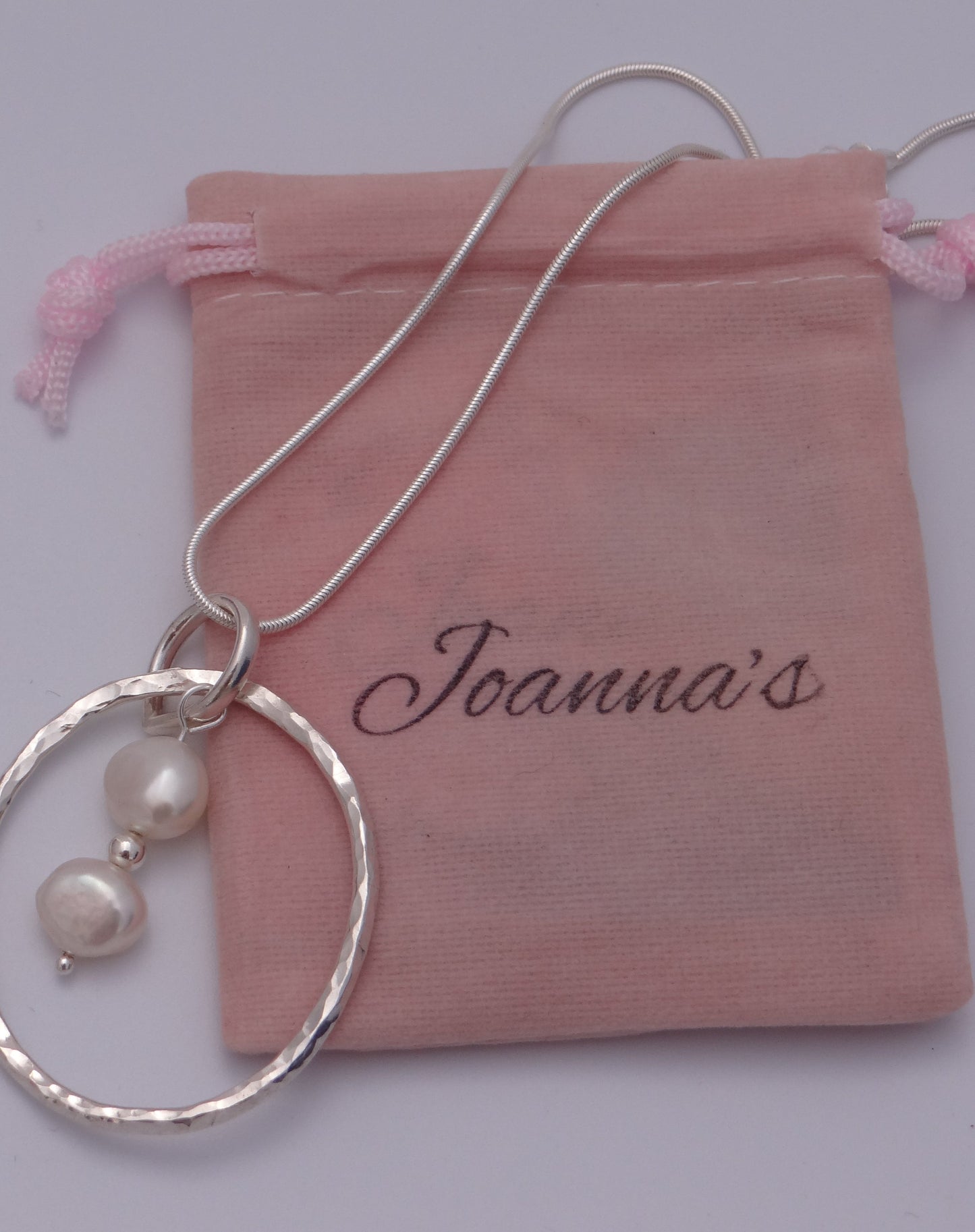 Joanna's designs packaging with Handmade sterling silver circle pendant with pearls
