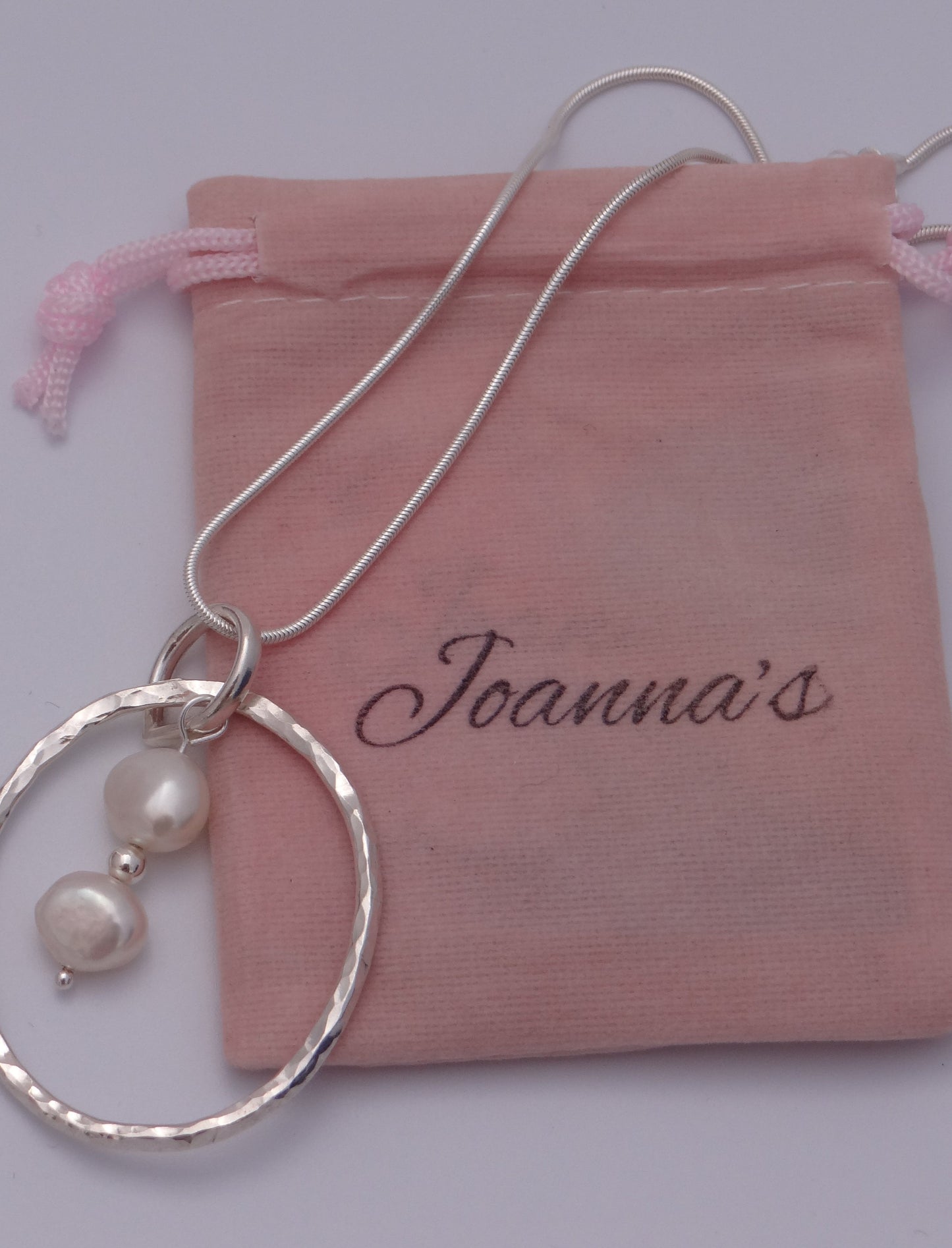 Joanna's Designs packaging with large circle sterling silver pendant with pearls
