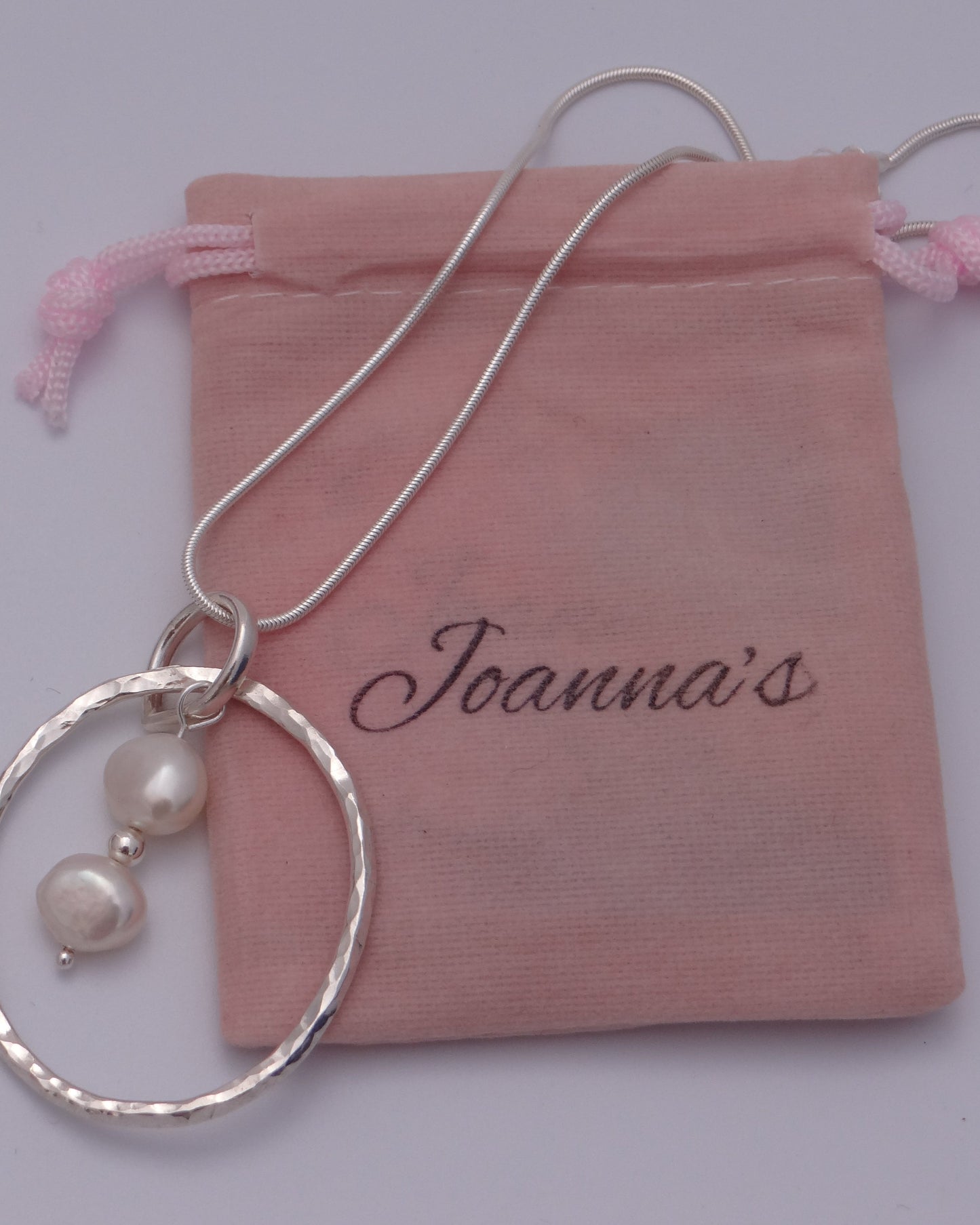 Joanna's Designs packaging with large circle sterling silver pendant with pearls