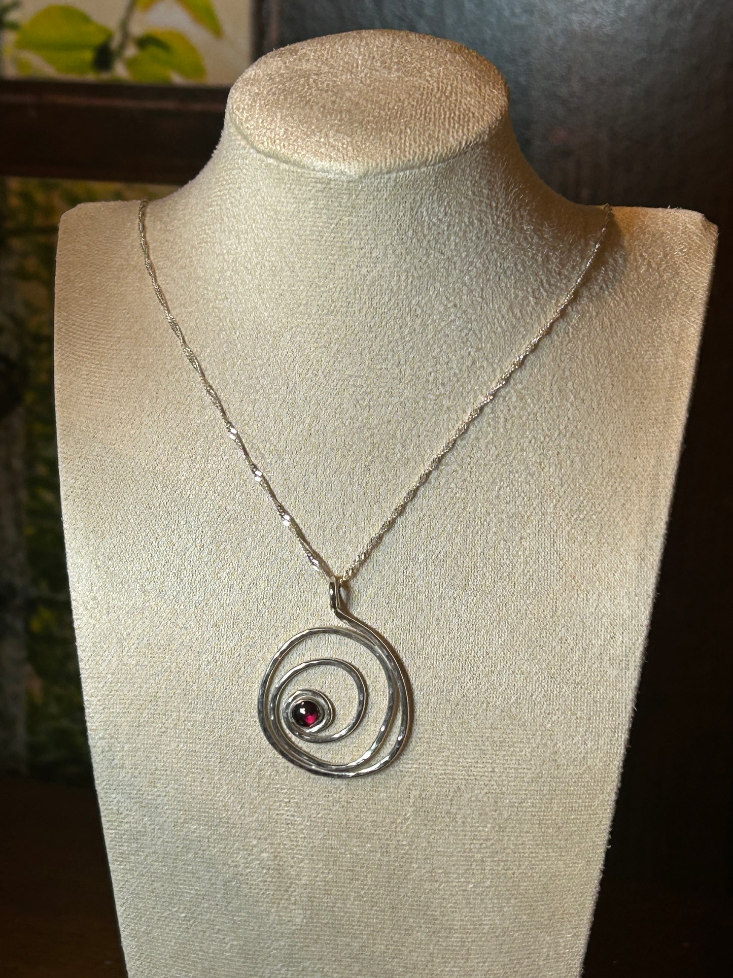 Handmade sterling silver hammered garnet pendant