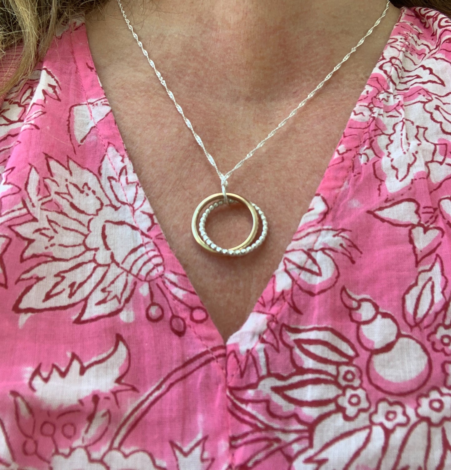 Handmade sterling silver and 9ct gold hallmarked entwined circle pendant