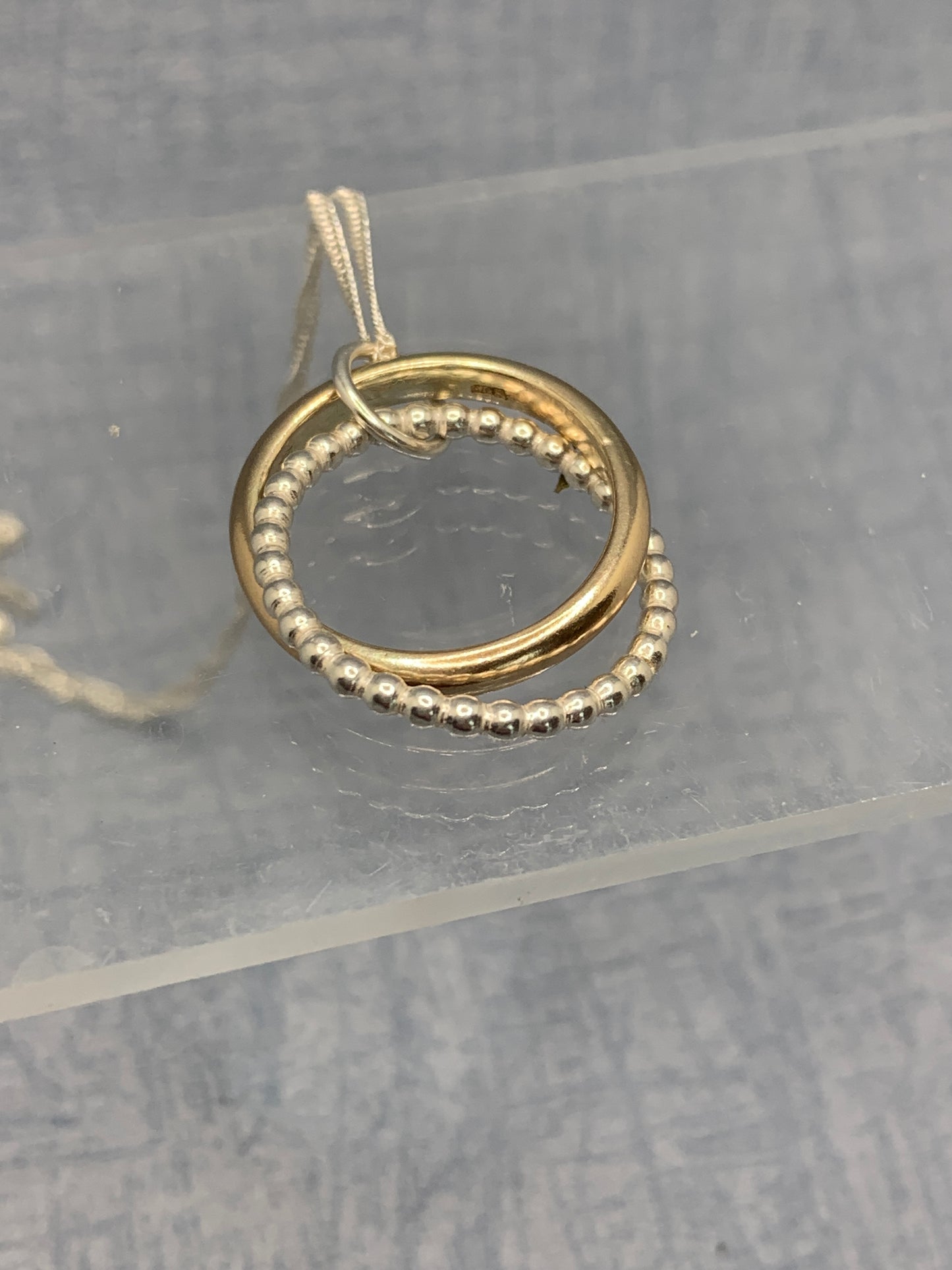 Handmade sterling silver and 9ct gold hallmarked entwined circle pendant