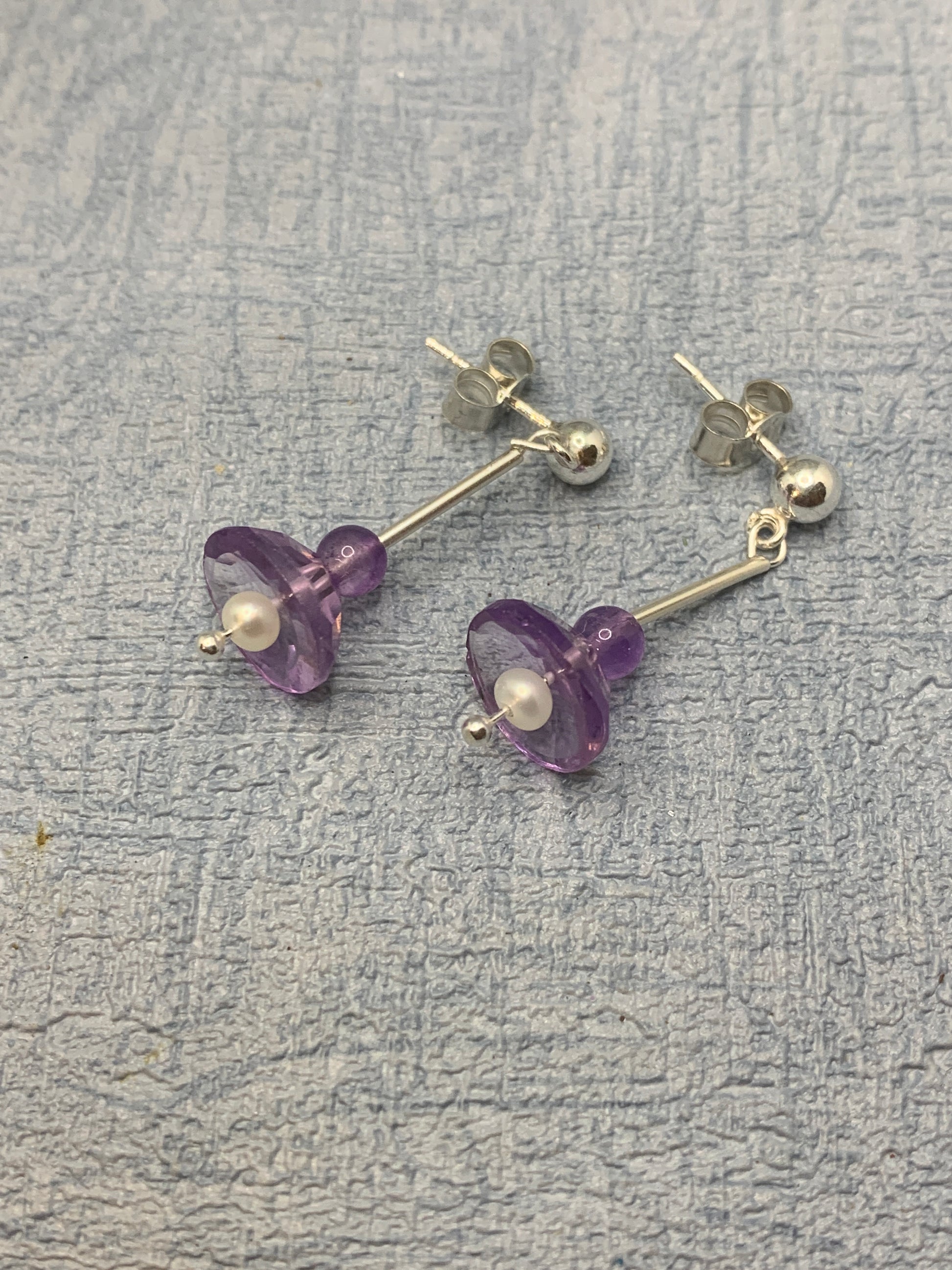 Handmade sterling silver stud earrings with amethyst gemstones and pearls