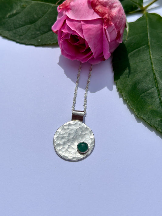 Handmade sterling silver hammered pendant with emerald stone