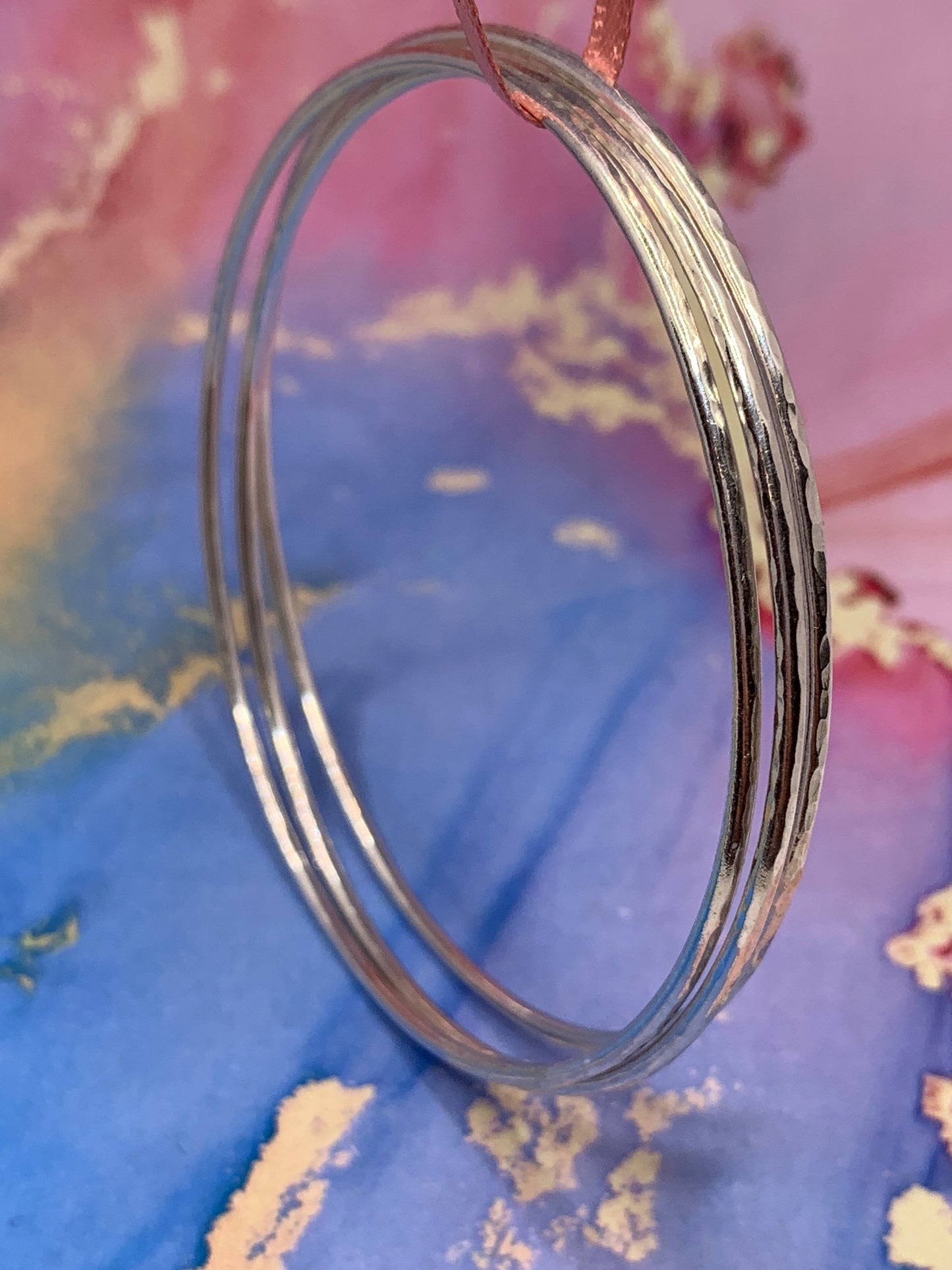 Handmade hammered slim sterling silver bangles