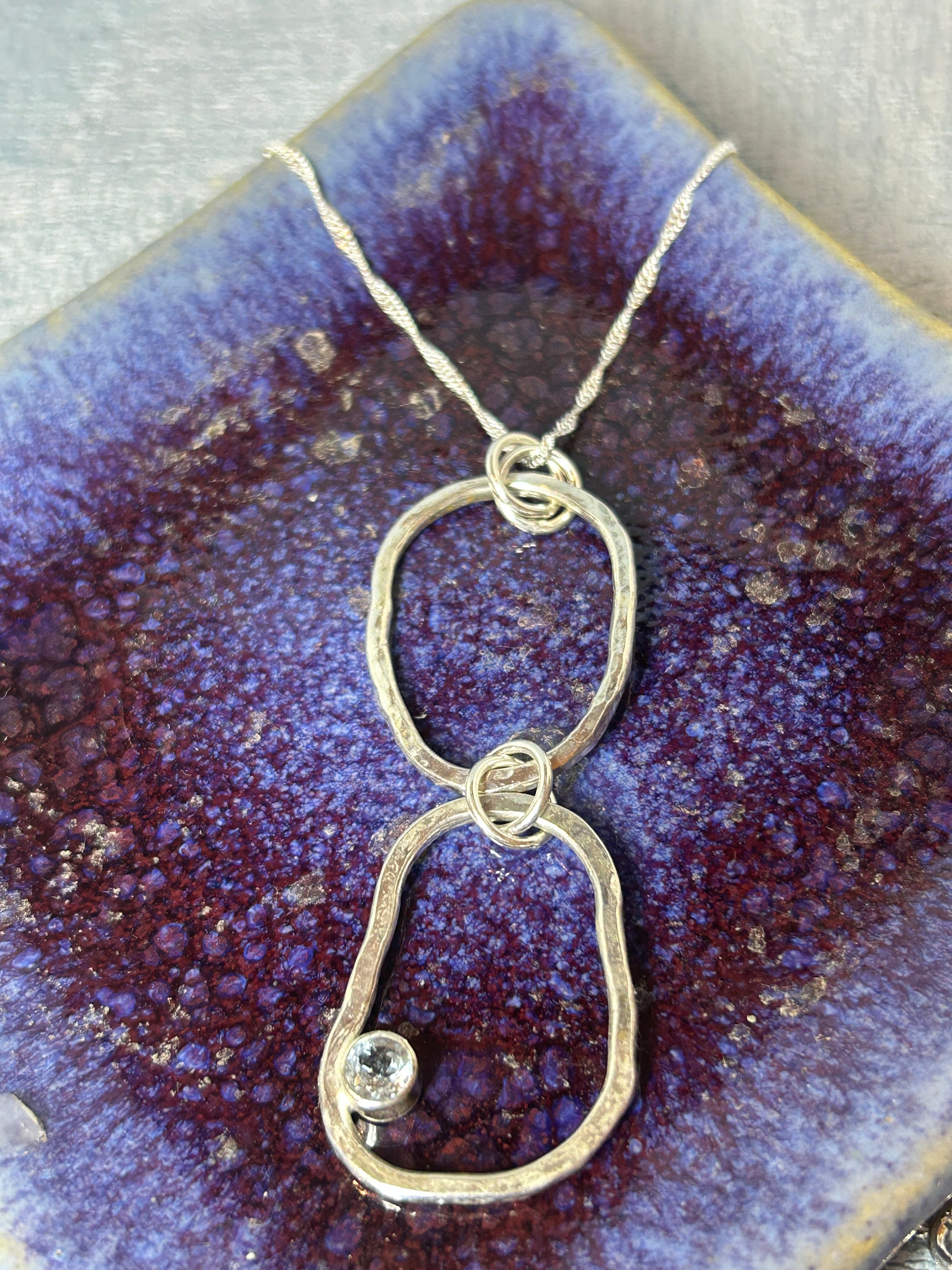 Handmade sterling silver pendant with blue topaz gemstone