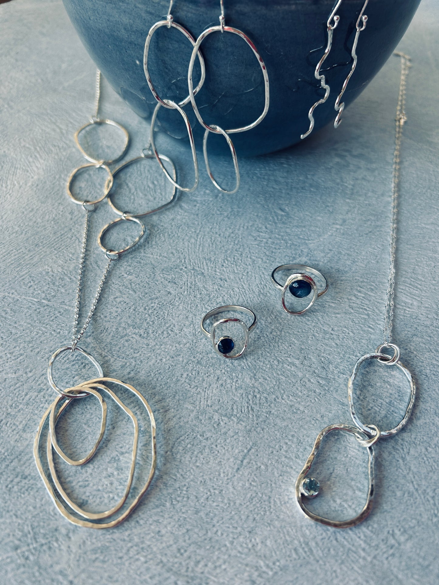 Collection of handmade sterling silver earrings, necklaces and rings