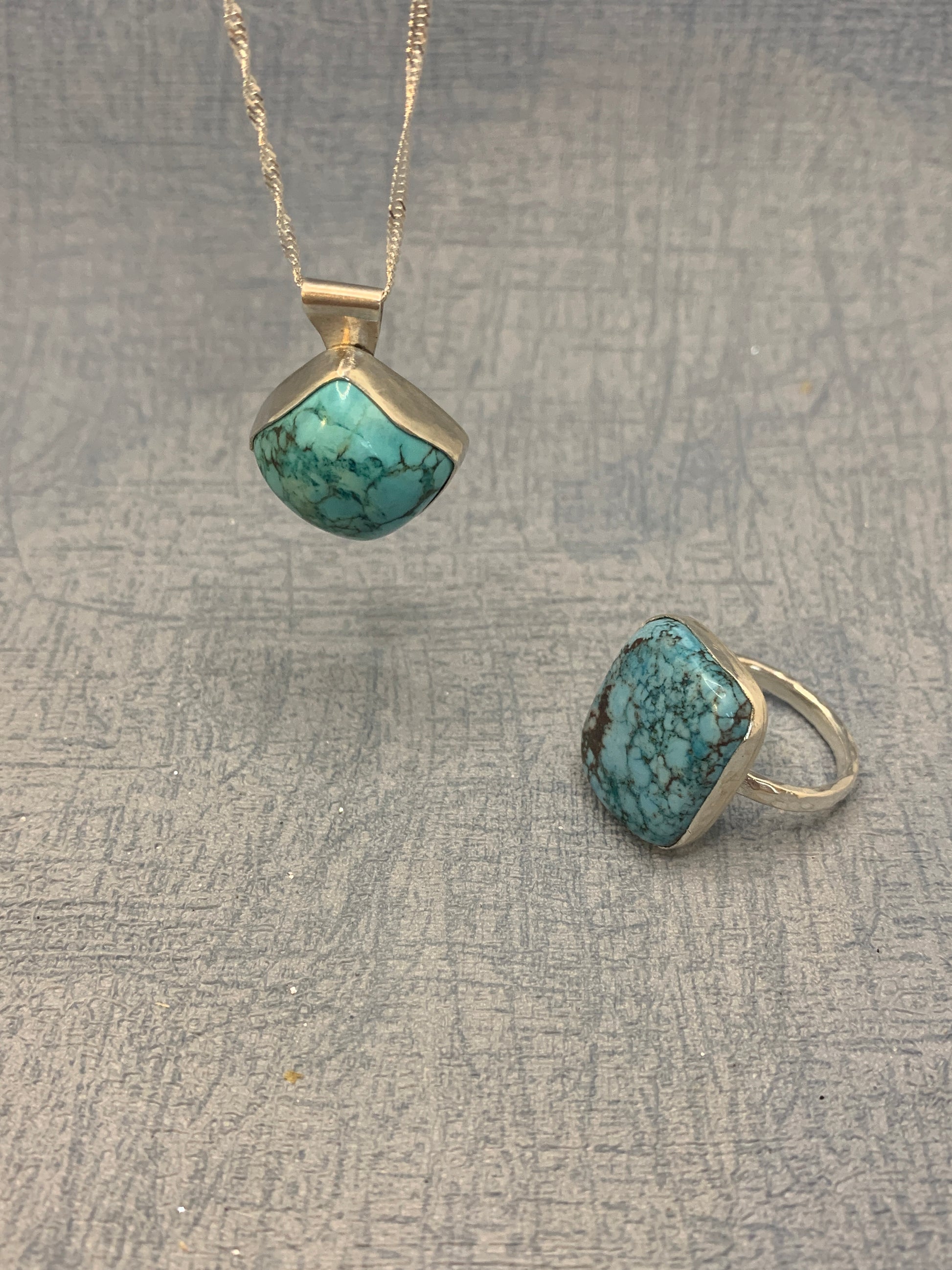 Handmade sterling silver ring and pendant with turquoise gemstone